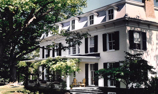 The Oak Hill mansion beneath a large oak tree